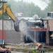 An excavator knocked down a portion of the old Georgetown Mall as it is demolished on Tuesday, May 28, 2013. Melanie Maxwell | AnnArbor.com